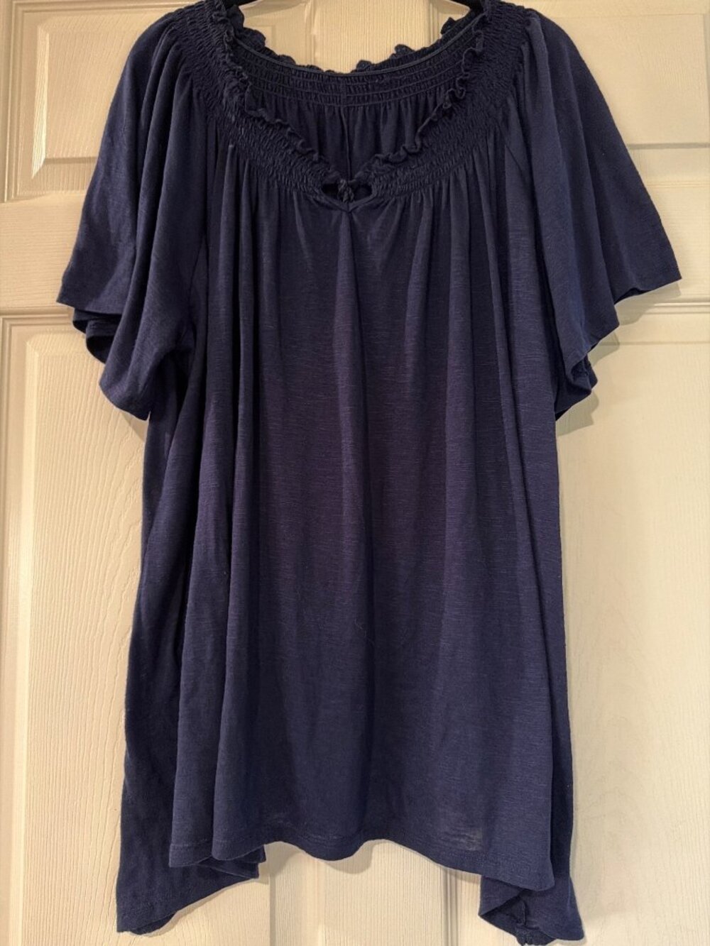 Flowy Navy Blue Smocked Tunic Top With Tassel Details Short Sleeves & Relaxed Fi